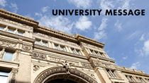 View of Main Building&#39;s Chestnut Street entrance with the text &quot;University message.&quot;