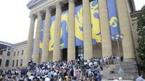 Students head up the stairs into the art museum.