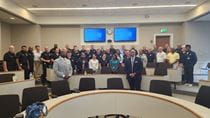 Three rows of 28 people in a rooom.