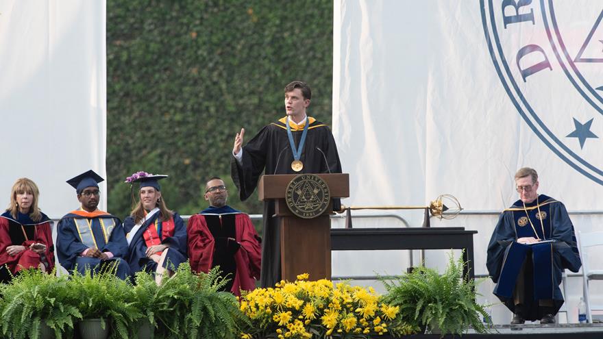 Justin Best at the podium at Drexel&#39;s Commencement