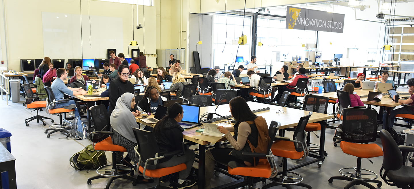 An open warehouse interior with tables and equipment at the Innovation Studio.