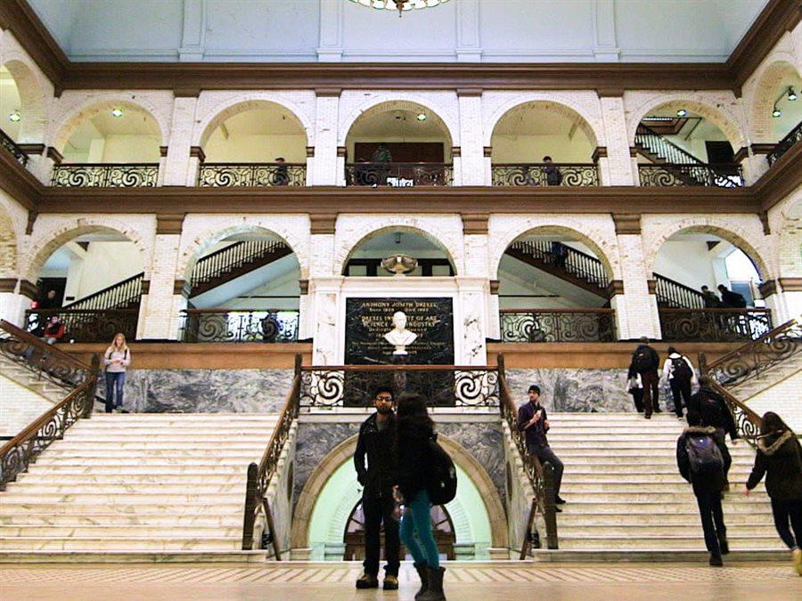 Students walking though great court of main building